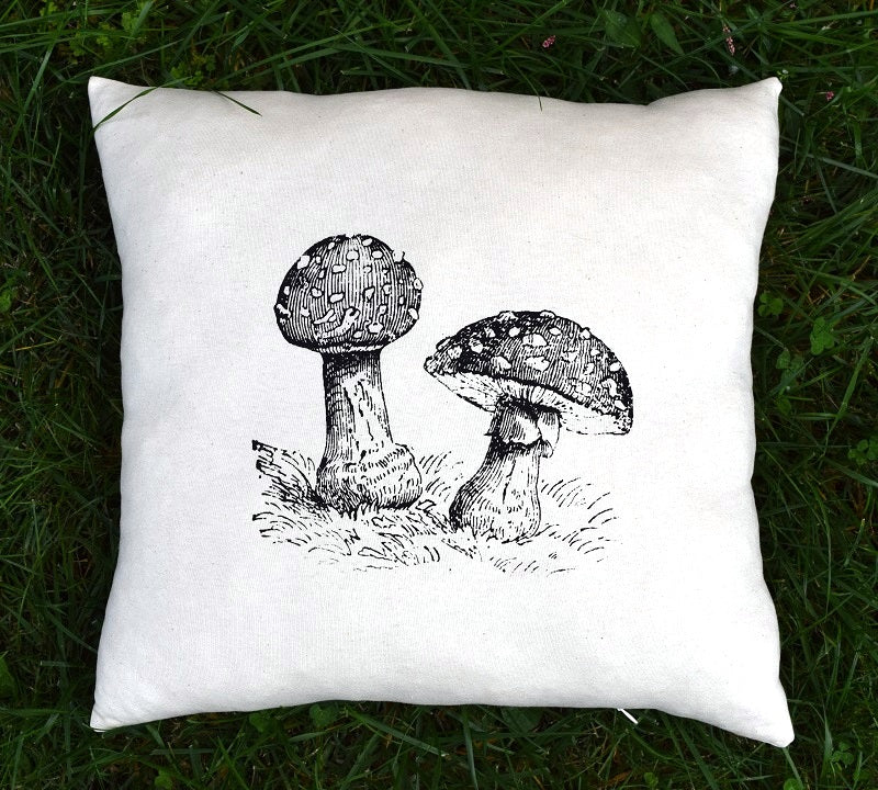 Fly agaric fairy mushroom printed throw decor pillow 17 in x 17 in made from 100% organic texas grown cotton and filled with a sustainable and premium cluster  fiber.  Handmade by A Little Pillow Company