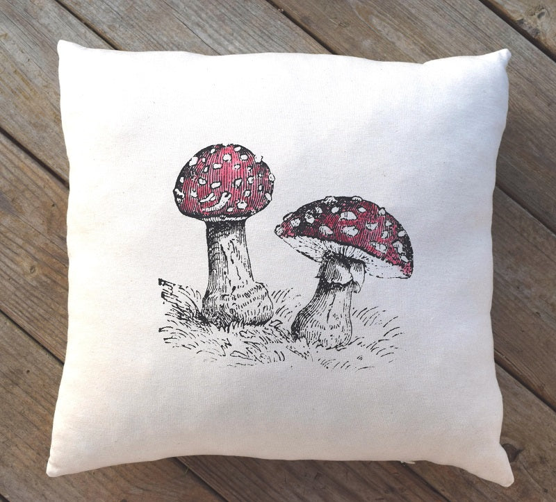 Fly agaric fairy mushroom printed throw decor pillow 17 in x 17 in made from 100% organic texas grown cotton and filled with a sustainable and premium cluster  fiber.  Handmade by A Little Pillow Company